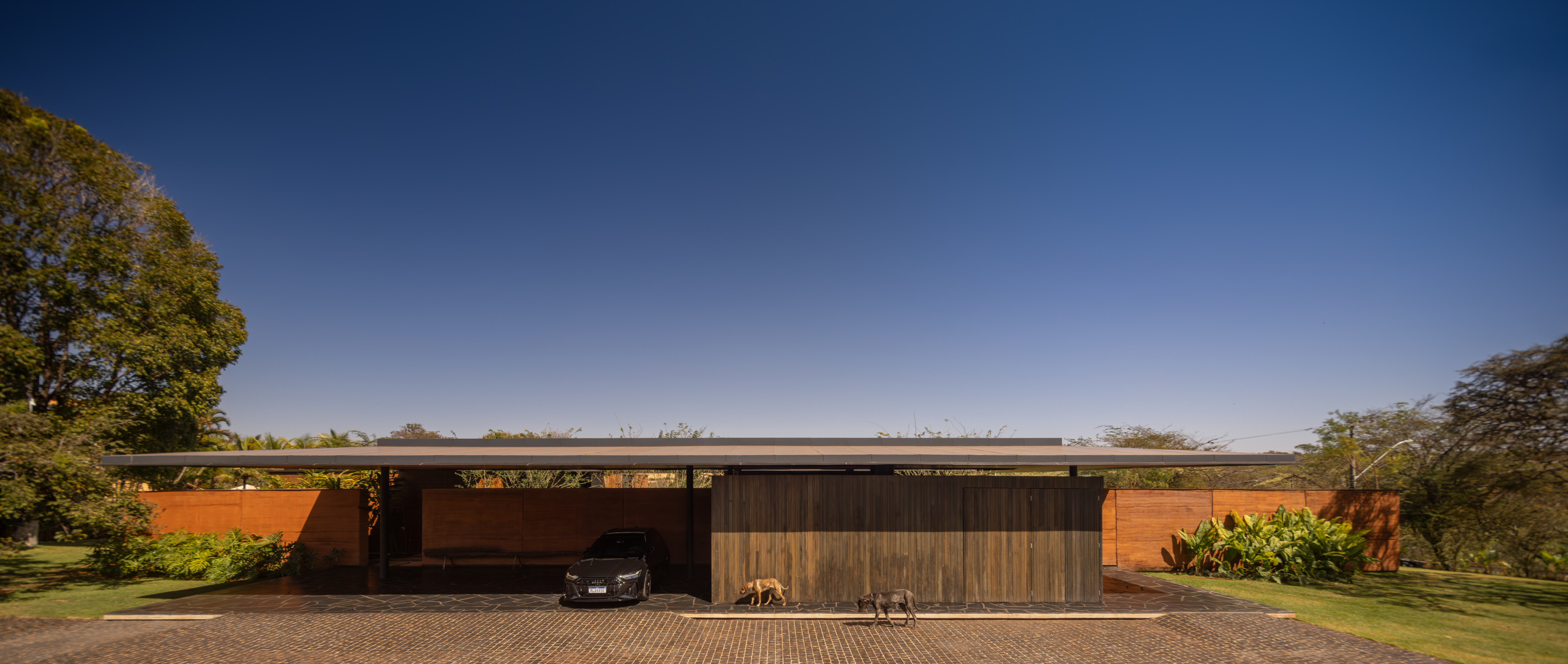 The house is set low in the landscape