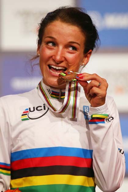 Lizzie Armistead checks her medal is real gold