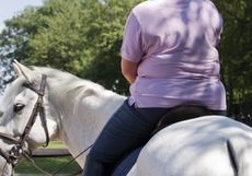 A larger rider pictured from behind