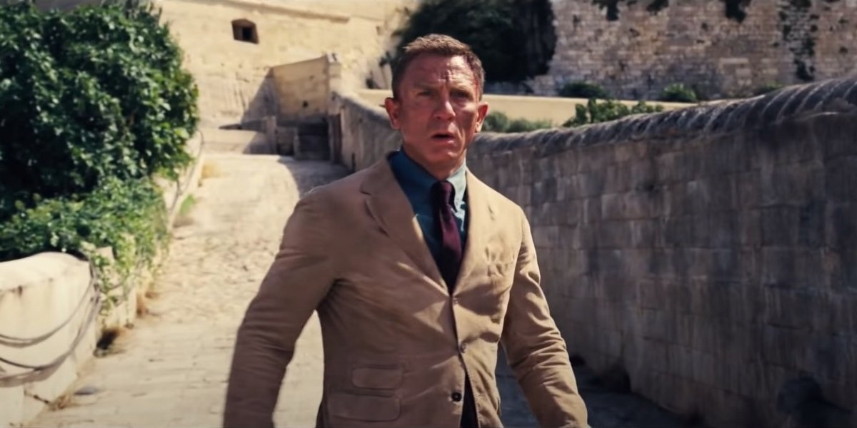 Daniel Craig looks scuffed up on the bridge in No Time To Die.