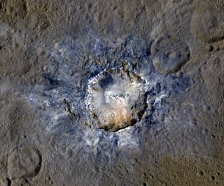 Ceres' 21-mile-wide (34 kilometers) Haulani Crater shows evidence of landslides from its rim.