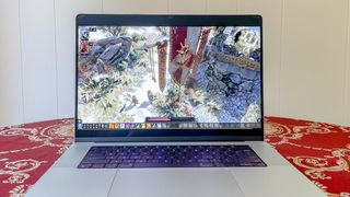 MacBook Pro 2021 (16-inch) on a table running Divinity: Original Sin II