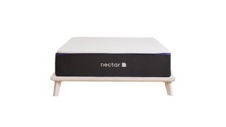A Nectar Premier mattress UK on a bed frame against a white background
