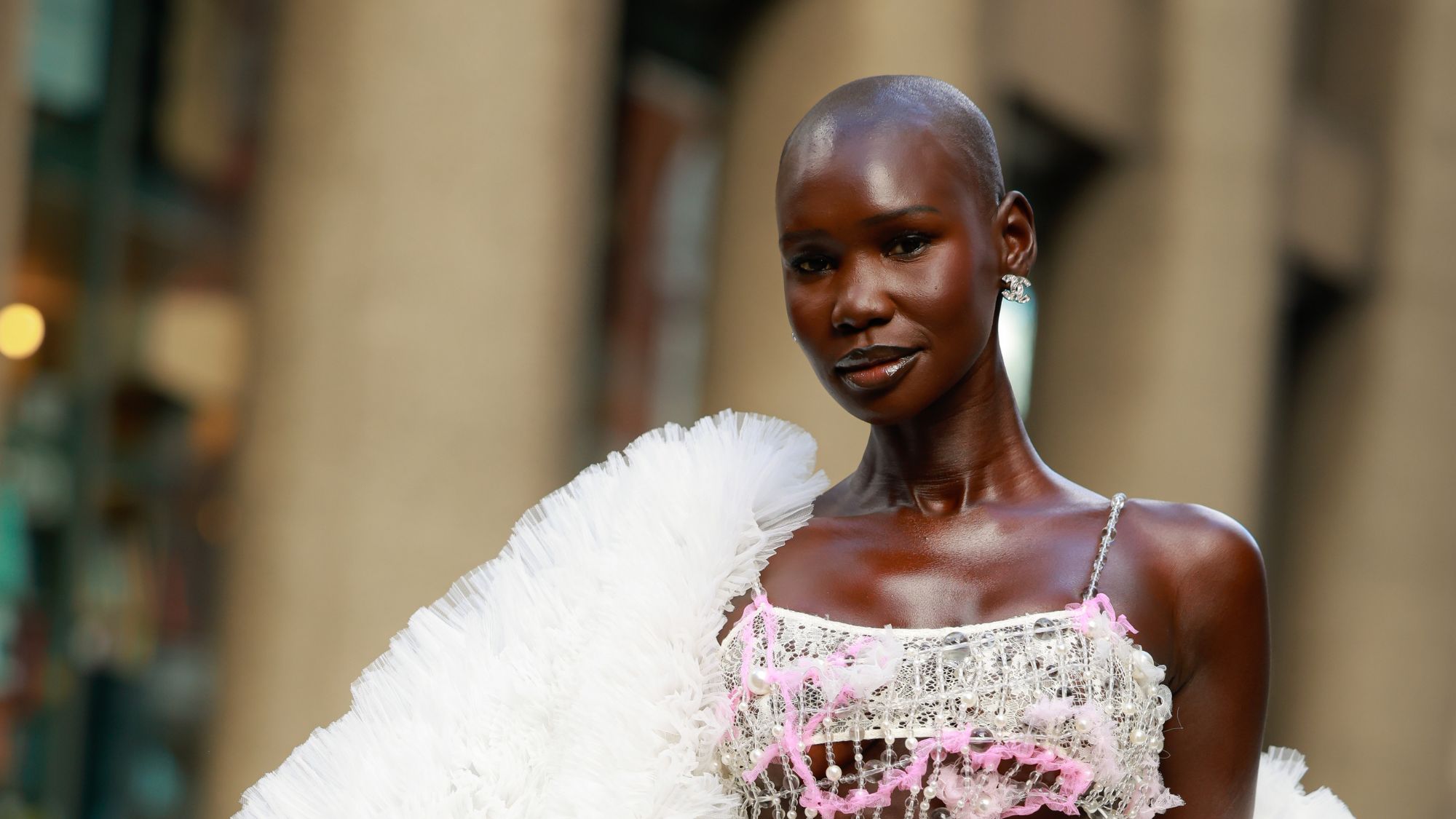 Adot Gak on the streets of Paris wearing blusher