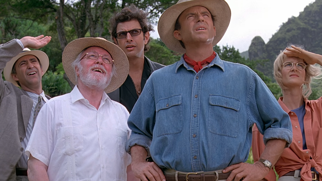 The cast of Jurassic Park looks up curiously.