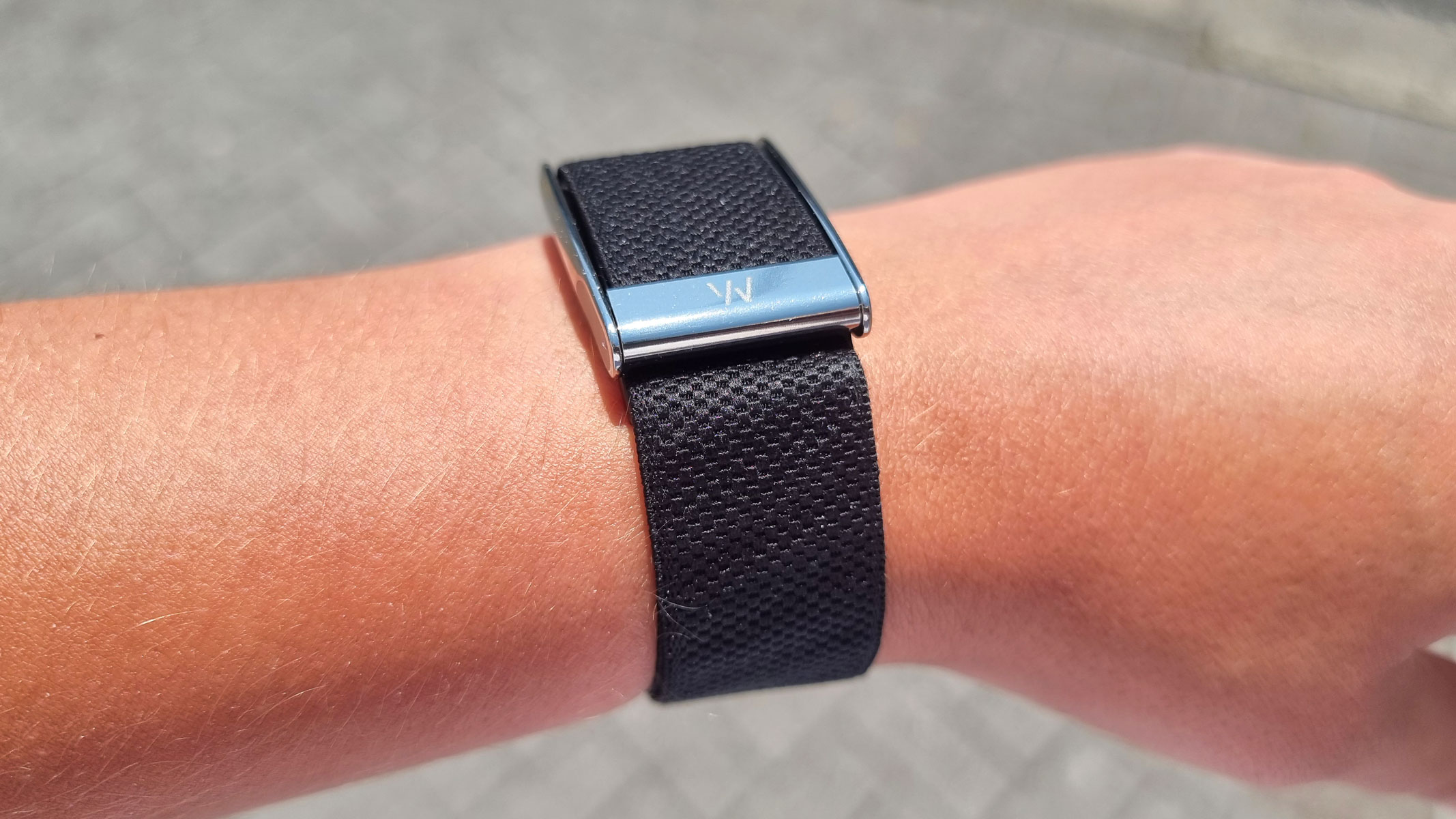 A close-up picture of our reviewer wearing the Whoop MG fitness tracker