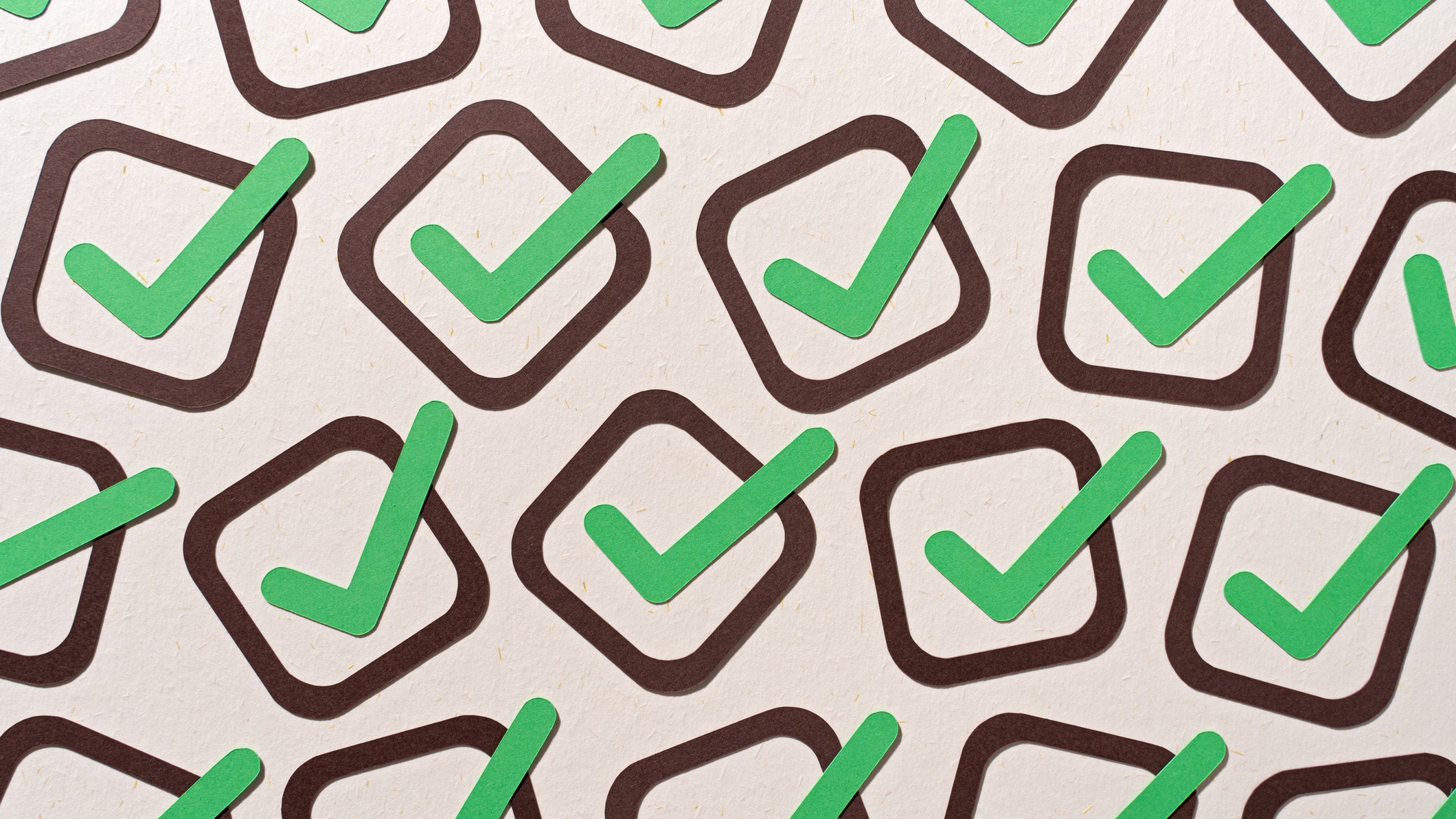 a page full of green checkmarks in brown boxes