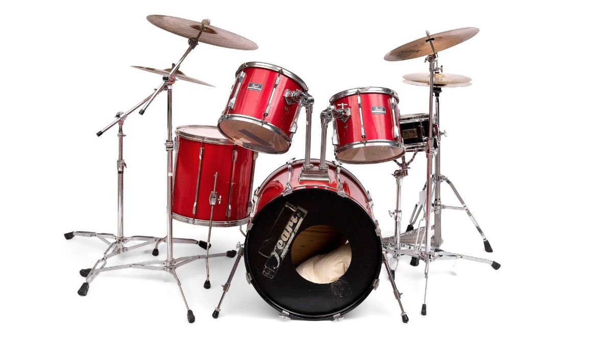 Former Oasis drummer Tony McCarroll&#039;s red Pearl Export drum kit, pictured for auction in 2014