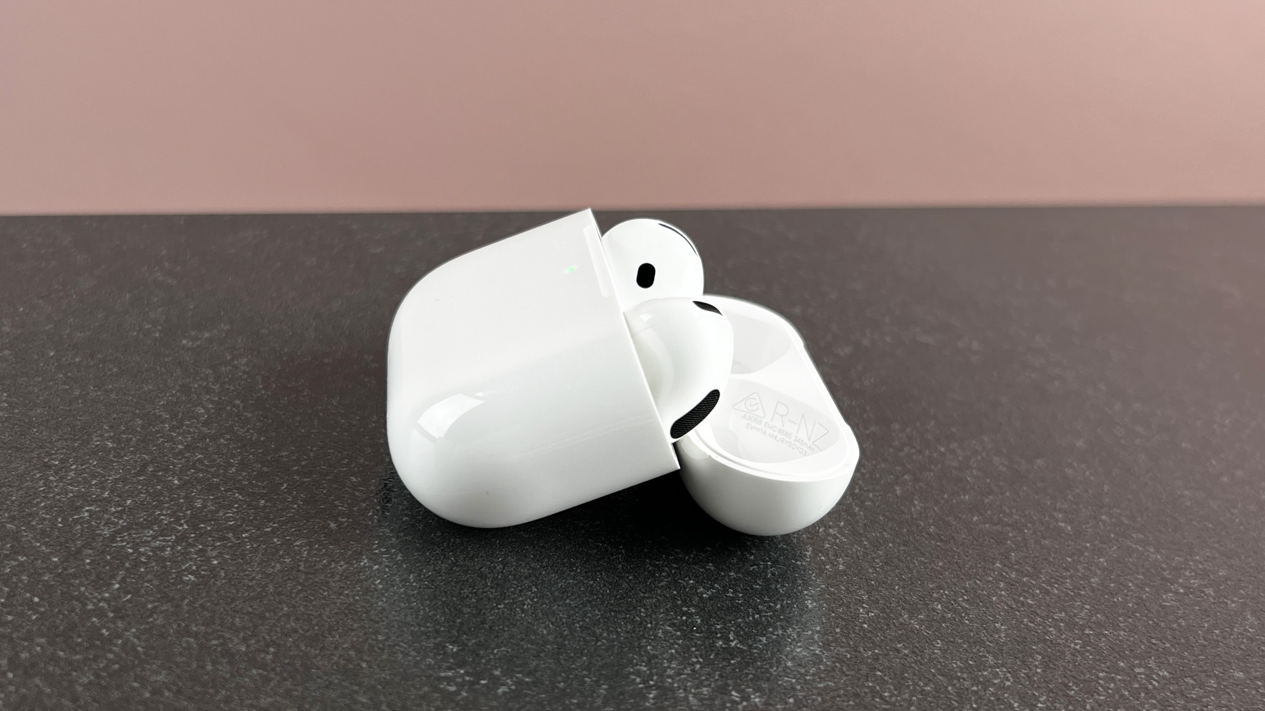 AirPods 4 case sideways on a table