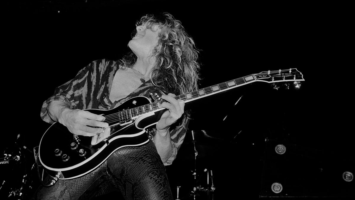 John Sykes performs onstage with Whitesnake at the UIC Pavilion in Chicago, Illinois on November 10, 1984