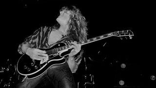 John Sykes performs onstage with Whitesnake at the UIC Pavilion in Chicago, Illinois on November 10, 1984