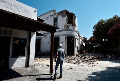 A tourist bar collapsed in an earthquake on Kos, killing two