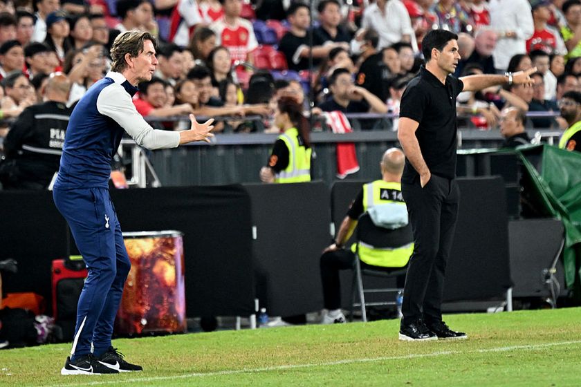 Tottenham Hotspur manager Thomas Frank (L) and Arsenal manager Mikel Arteta (R) gesture from the touchline during their friendly exhibition football match at the Kai Tak Stadium in Hong Kong on July 31, 2025. 