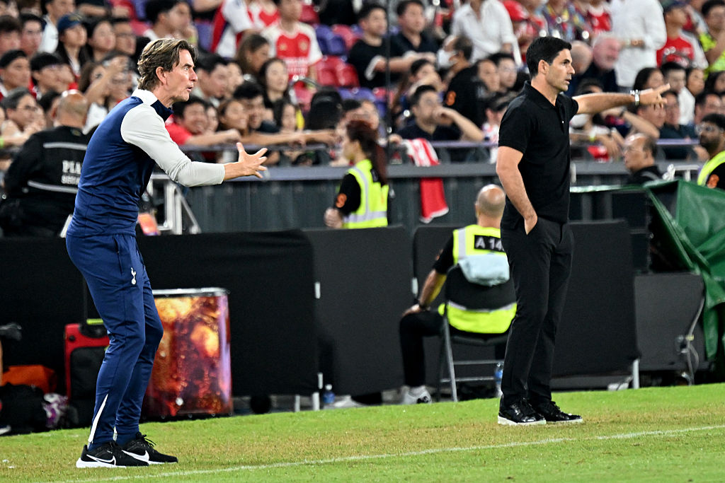 Tottenham Hotspur manager Thomas Frank (L) and Arsenal manager Mikel Arteta (R) gesture from the touchline during their friendly exhibition football match at the Kai Tak Stadium in Hong Kong on July 31, 2025.