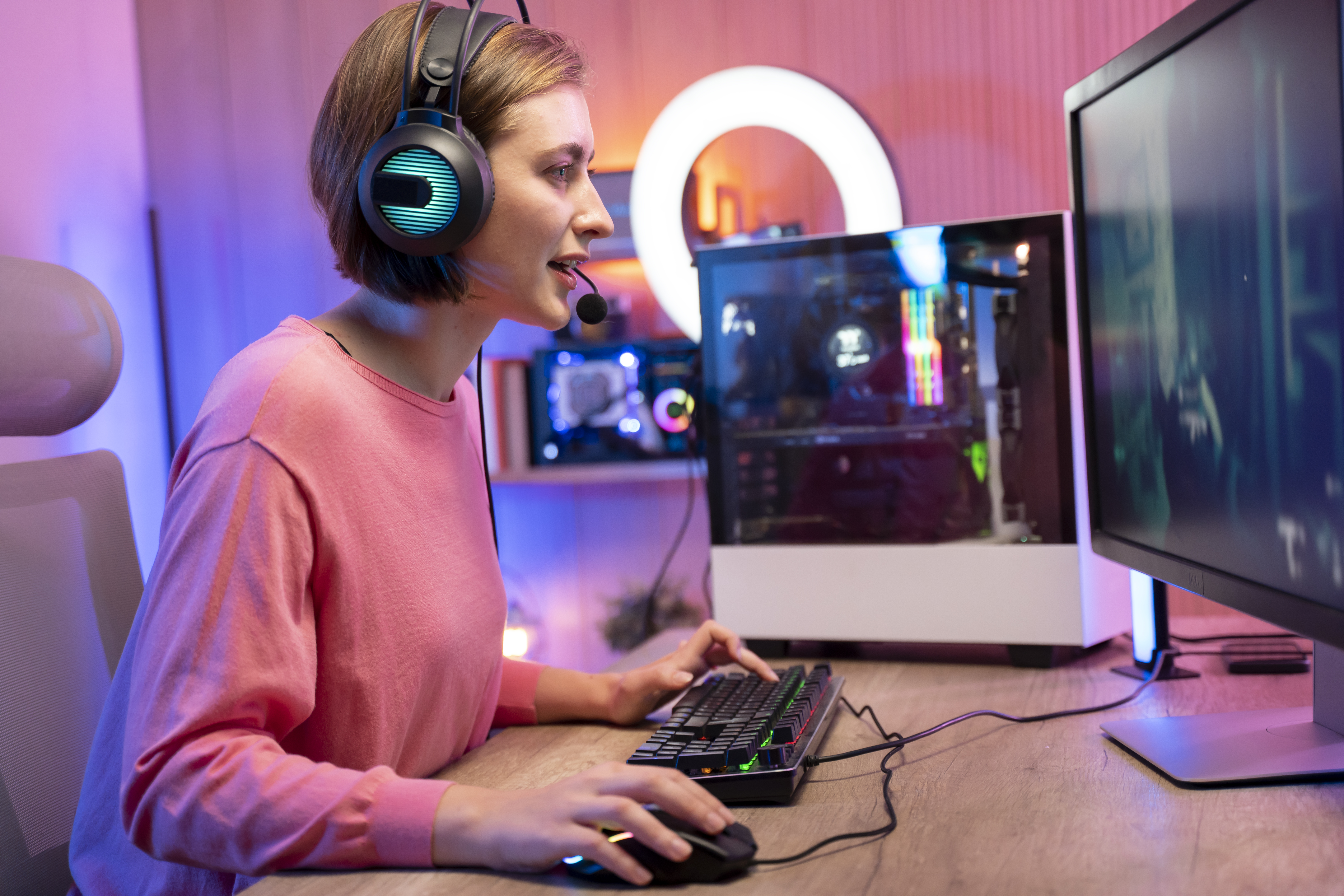Woman playing online and streaming video games at home