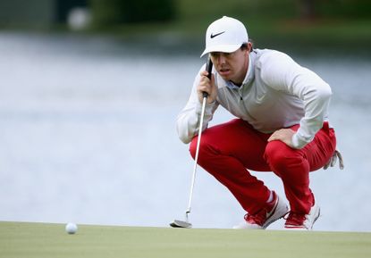 Rory McIlroy dodges golf ball