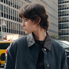 A Zara model wearing a contrast-collar barn jacket on the streets of New York City.