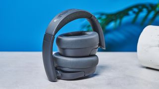 a pair of graphite gray headphones by JLab with 3 buttons