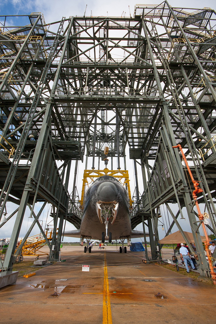 The nose landing gear of space shuttle Endeavour is lifted during operations to raise the shuttle for securing to the Shuttle Carrier Aircraft on Sept. 14, 2012.