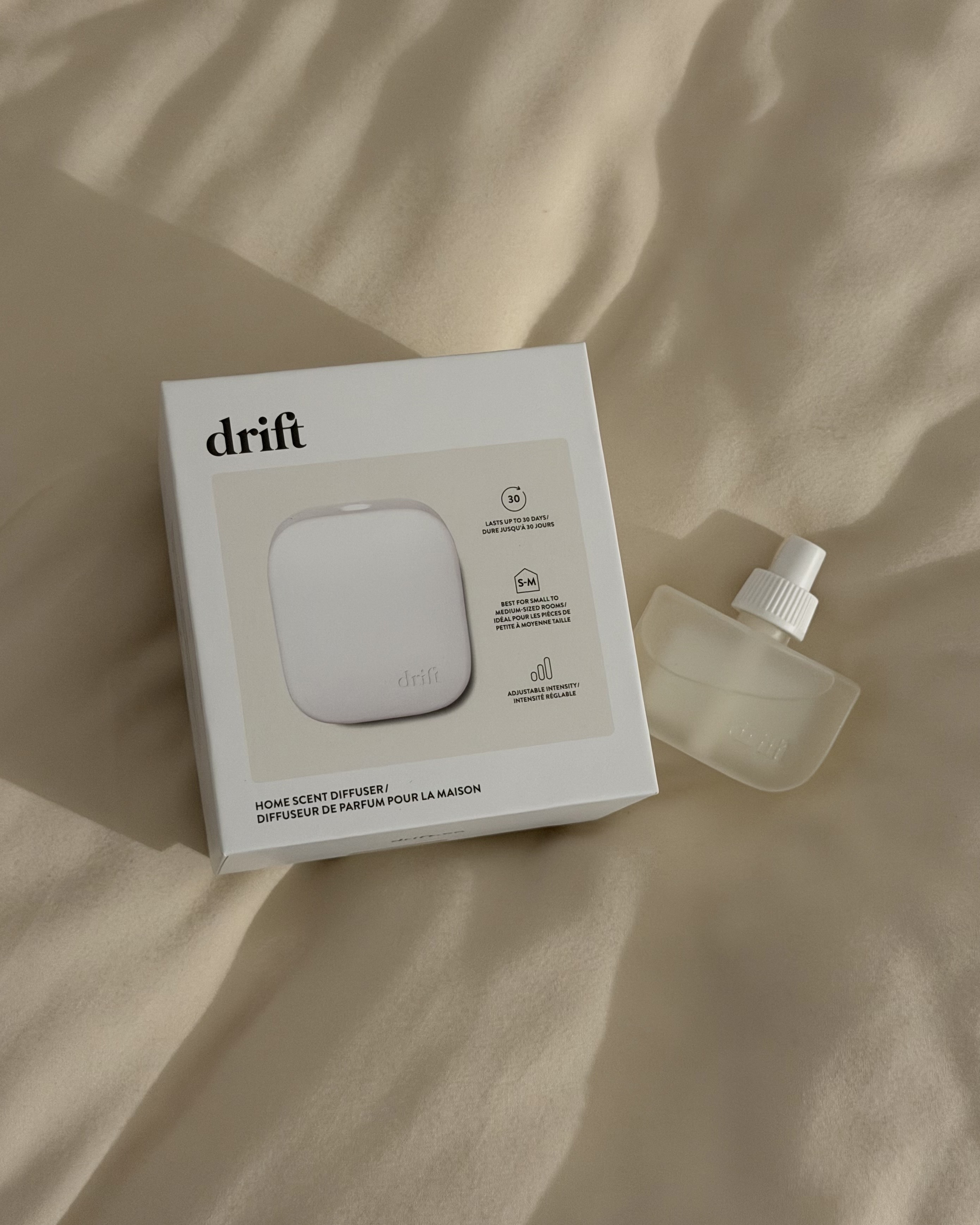 Drift's Home Scent Diffuser in Rest &amp; Relax on a bed.