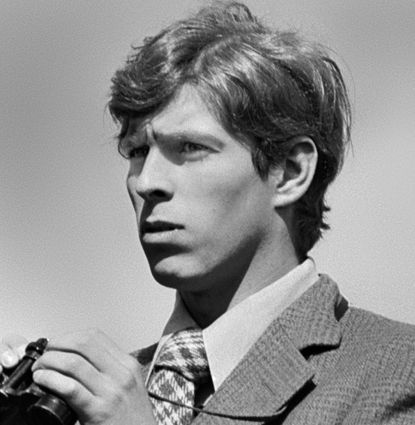 Prince Andrew holding binoculars in the 1970s