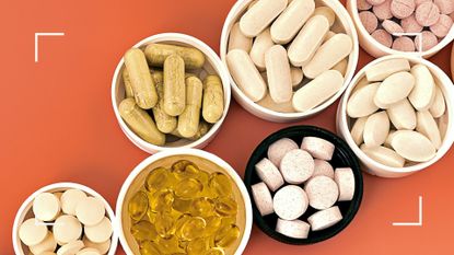 Selection of supplements for sleep in white and black bowls on bright orange background