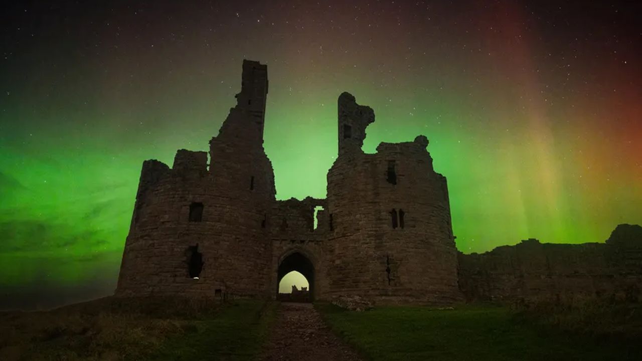Photograph of mysterious STEVE above Dunstanburgh Castle Northumberland, UK.