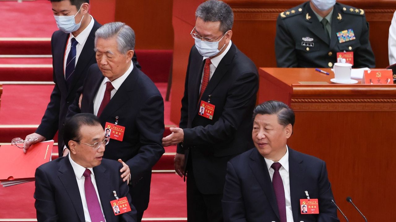 Hu Jintao is escorted from the conference