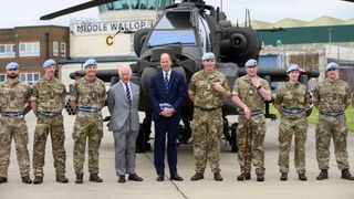 King Charles III and Prince William, Prince of Wales during the official handover in which King Charles III passes the role of Colonel-in-Chief of the Army air corps to Prince William