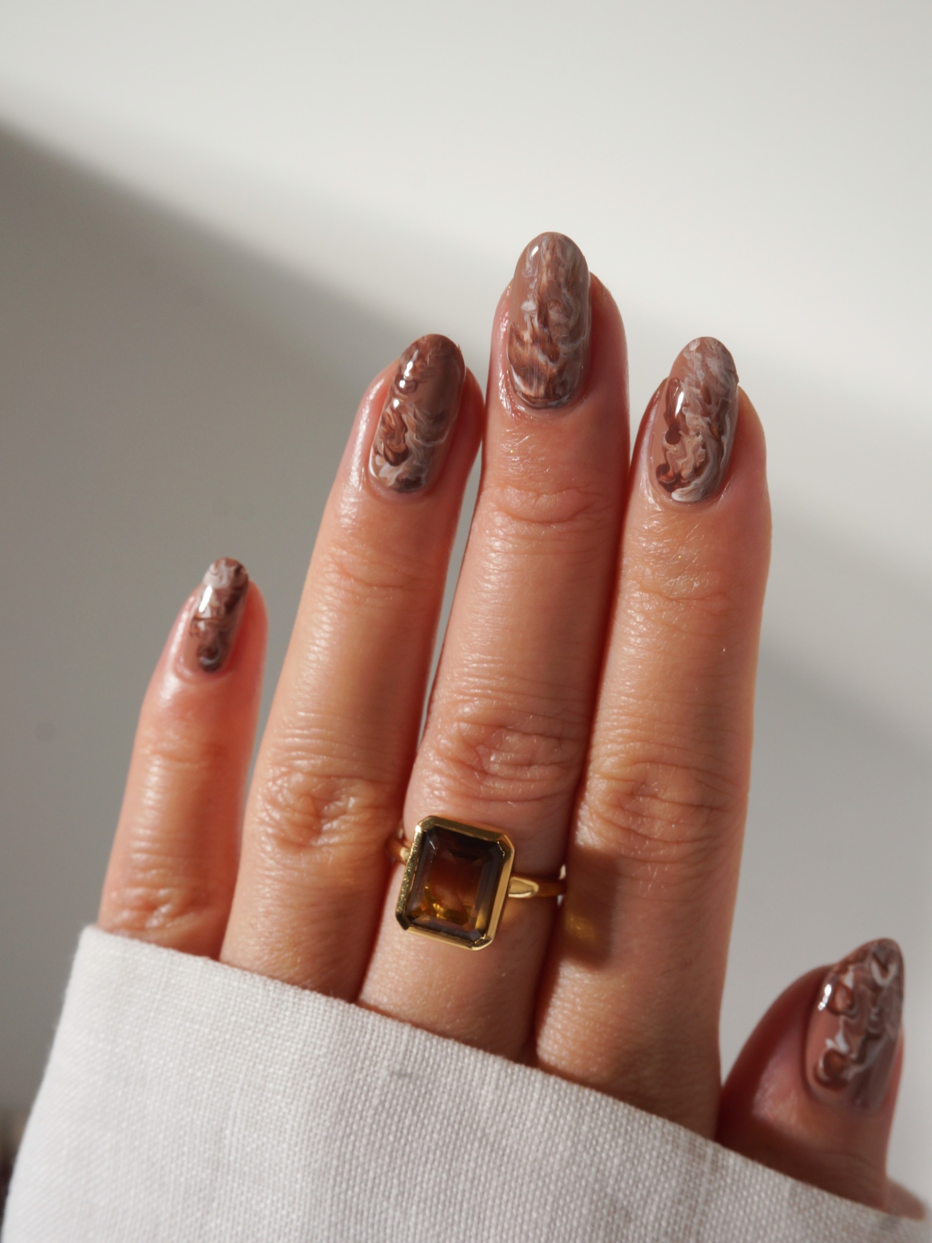 light brown and creamy white swirls mixed together for a coffee-inspired mani