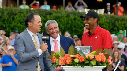 Dan Hicks interviewing Tiger Woods at the 2018 Tour Championship with Jay Monahan looking on