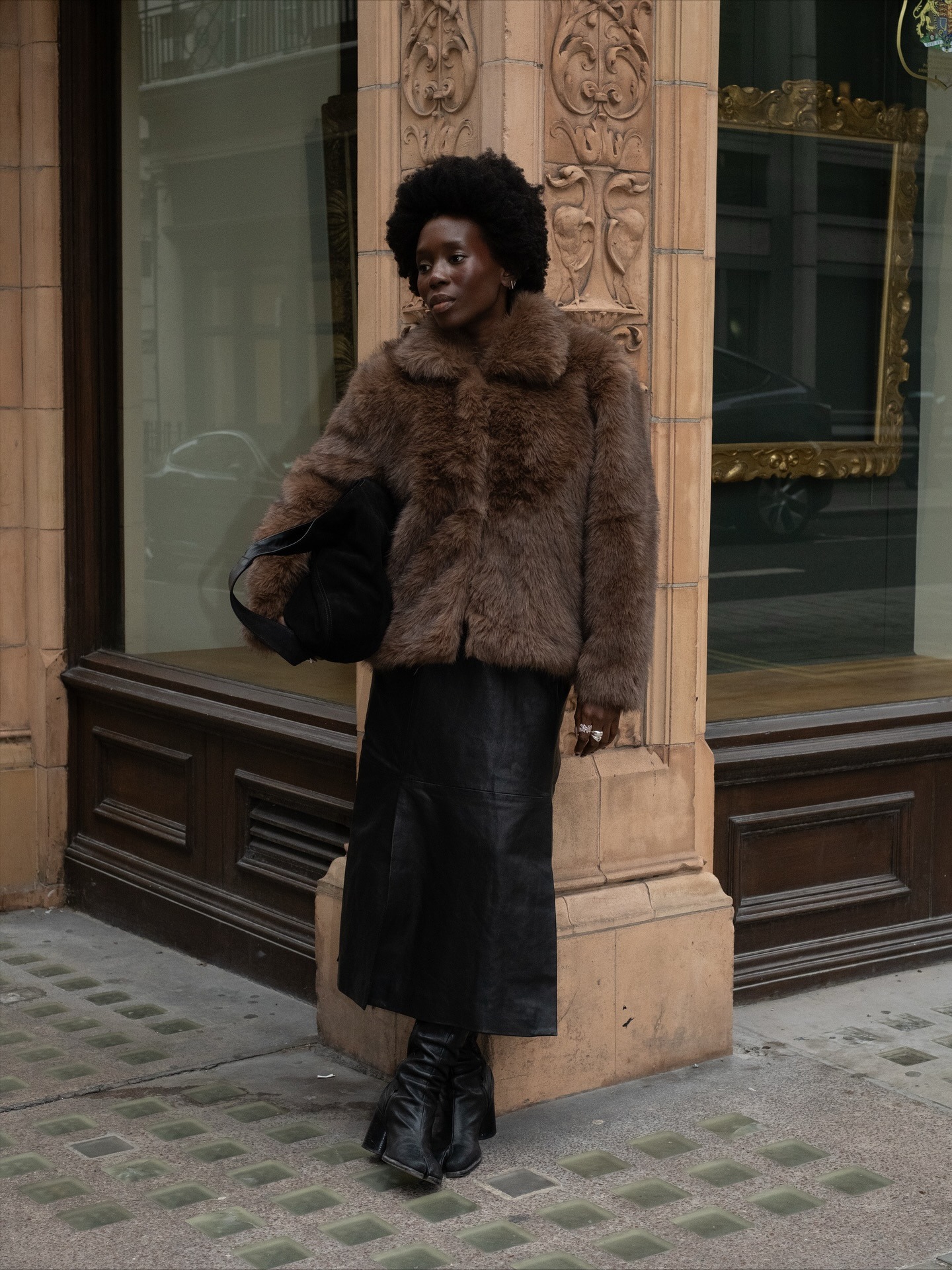 @daniellejinadu wearing a faux-fur coat.