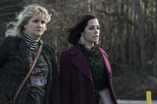 Parker Posey and Jillian Bell on a road in Tales of the Walking Dead