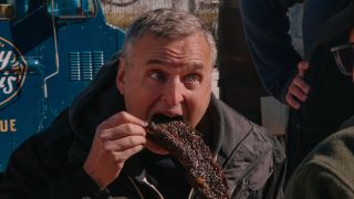 Phil Rosenthal eating meat in Somebody Feed Phil