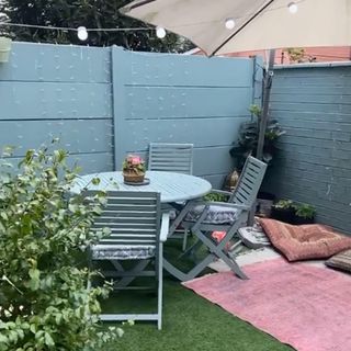 blue garden makeover with fire pit after