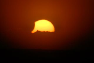 This photo of the partial solar eclipse on Nov. 25, 2011 was taken by Terre Maize-Nicholson from Otaki Beach in New Zealand.
