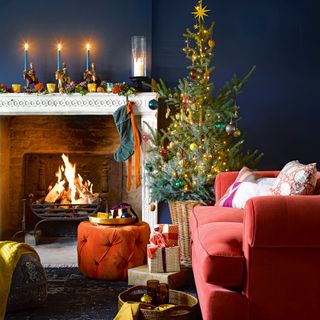 Blue living room with tree decorated with lights and baubles