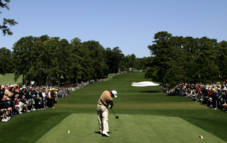 Tiger Woods hits his tee shot on the 8th at Augusta National