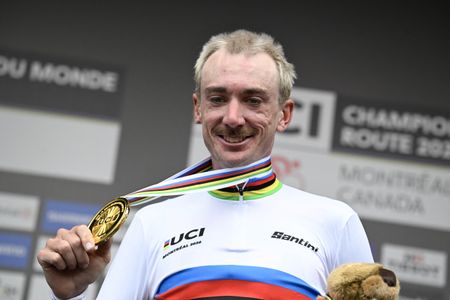 The United States' Brandon McNulty celebrates on the podium after winning the Men Elite Road Race during the 2026 Union Cycliste Internationale (UCI) Road World Championships in Montreal, Quebec, on September 27, 2026. (Photo by Andrej Ivanov / AFP)