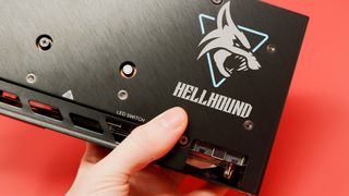 PowerColor Hellhound RX 7600 XT graphics card on a red background,