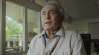 Dan Rather answers questions about his career while being interviewed in Rather.