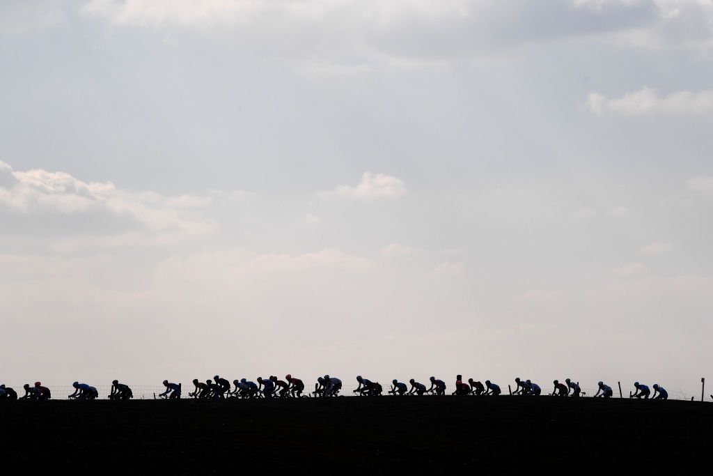 SIENA ITALY MARCH 05 A general silhouette view of the peloton competing during the Eroica 16th Strade Bianche 2022 Mens Elite a 184km one day race from Siena to Siena Piazza del Campo 321m StradeBianche WorldTour on March 05 2022 in Siena Italy Photo by Tim de WaeleGetty Images