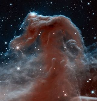 This Hubble image, captured and released to celebrate the telescope’s 23rd year in orbit, shows part of the sky in the constellation of Orion (The Hunter) in infrared light. Rising like a giant seahorse from turbulent waves of dust and gas is the Horsehead Nebula, otherwise known as Barnard 33. Image released April 19, 2013.