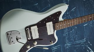 Squier Classic Vibe 60s Jazzmaster on a blue textured background