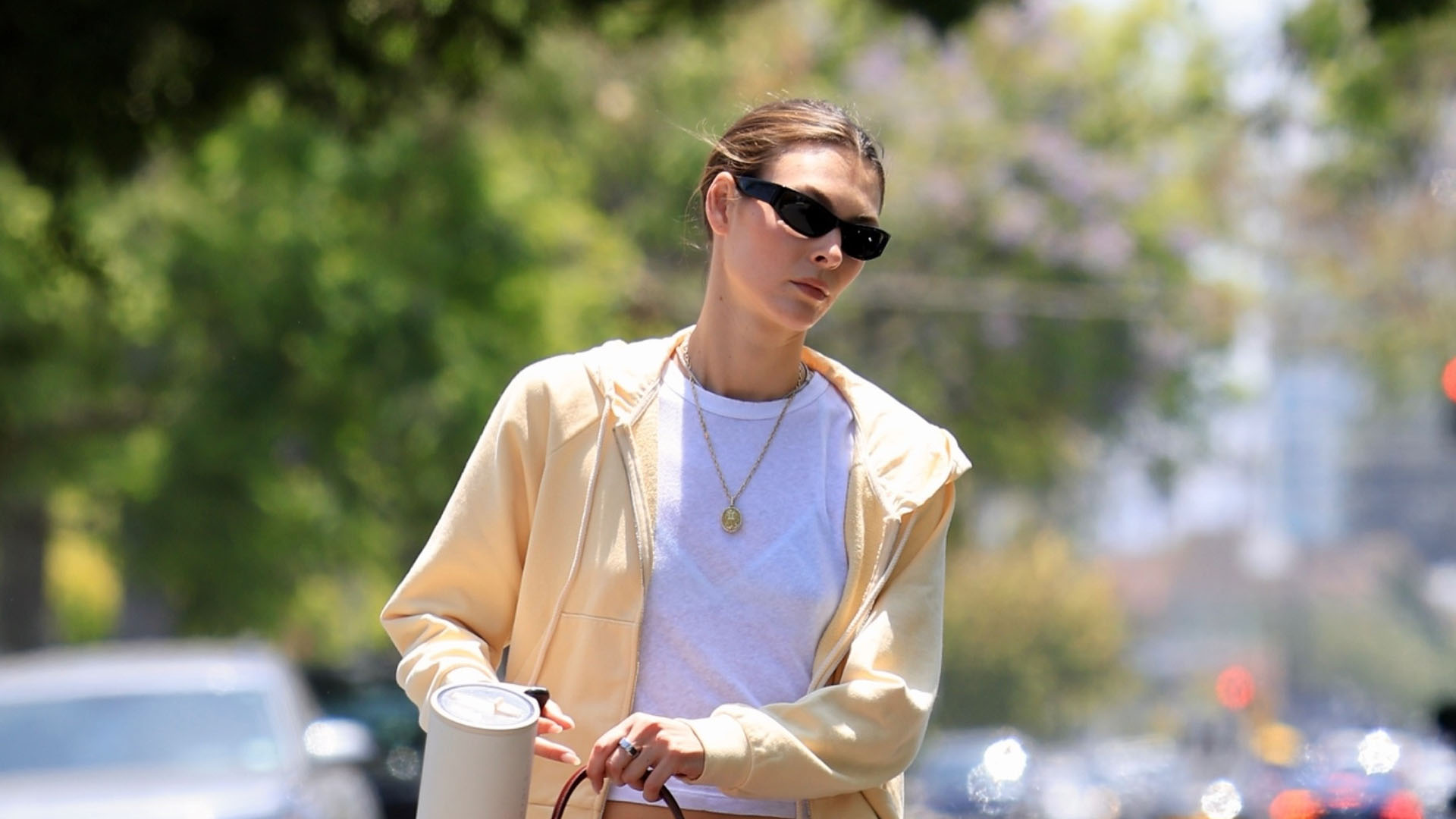 Vittoria Ceretti wearing a white tee and butter-yellow hoodie.