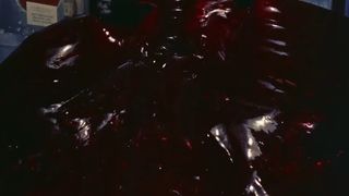 The Blob oozes out of a movie theater in the horror classic The Blob