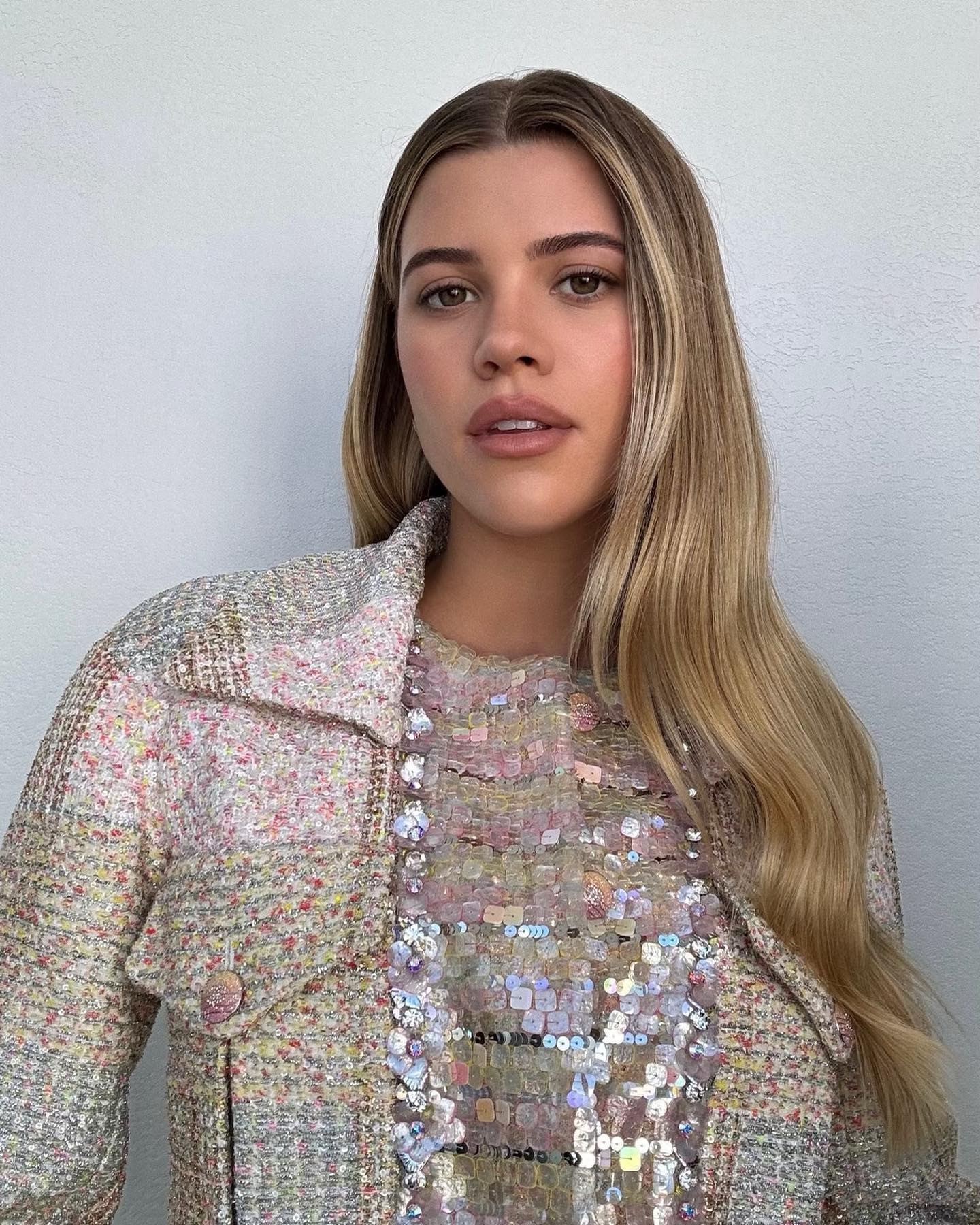 Sofia Grainge wearing a sequin Chanel outfit with blended blonde hair