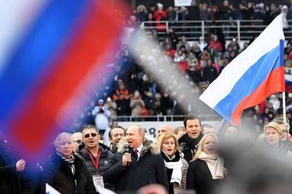 Putin attends a rally.