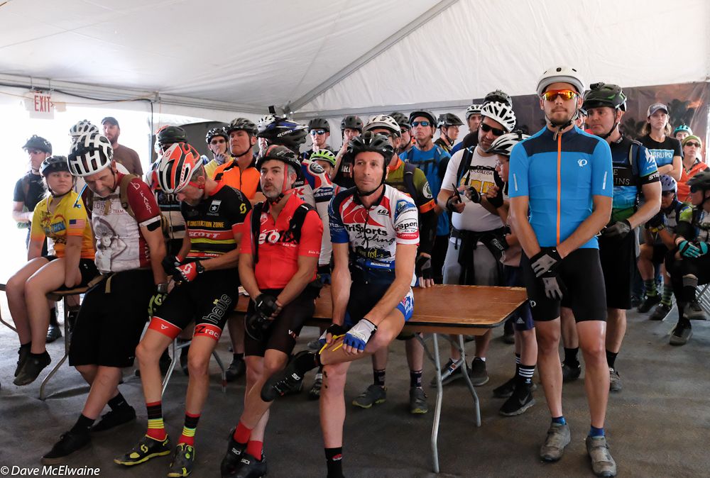 Team racers await a baton handoff at the start of lap two