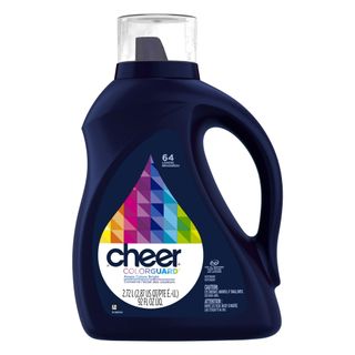 A side-on view of a dark blue bottle of laundry detergent